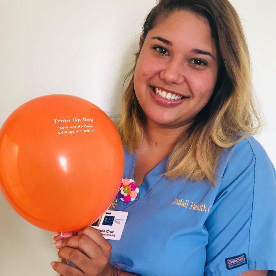 Patient Representative Holding Train Up Day Balloon