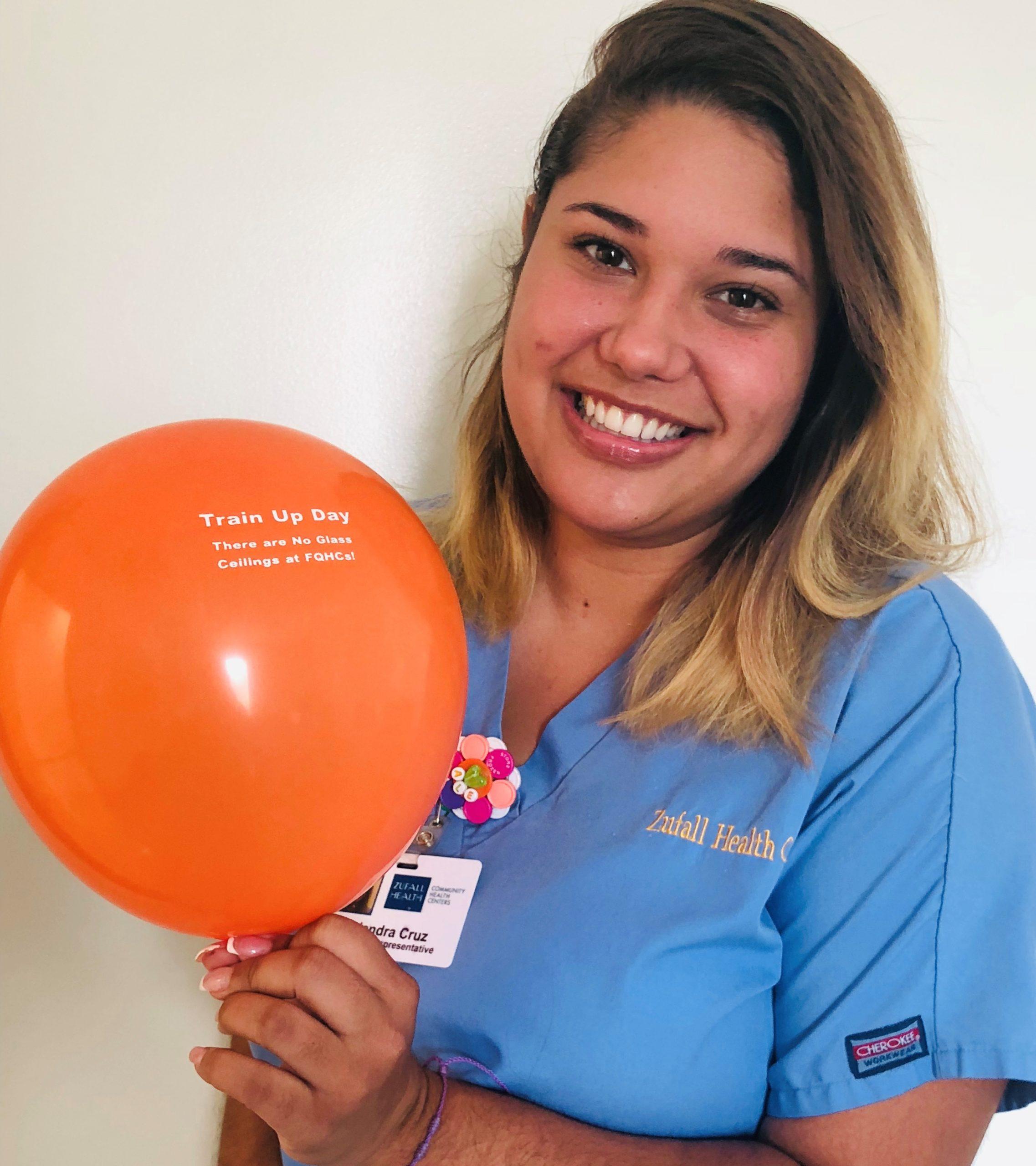 Patient Representative Holding Train Up Day Balloon