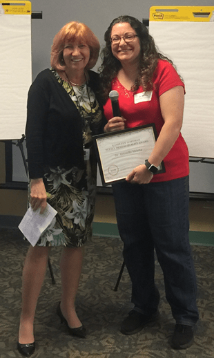 Zufall President and CEO Eva Turbiner standing with Dr. Antonella Maietta who is holding the Kathleen Nordman Dental Quality Award